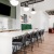 a spacious clubroom with a resident kitchen