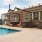 Resort-style swimming pool with lounge seating